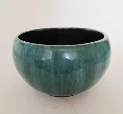 Nice BMP planter in the classic green drip glaze. There are no chips or cracks to the pottery. There...