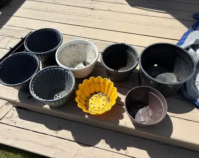 Variety of plant pots ready for a new home! Used mostly outdoors. Take all for $10!