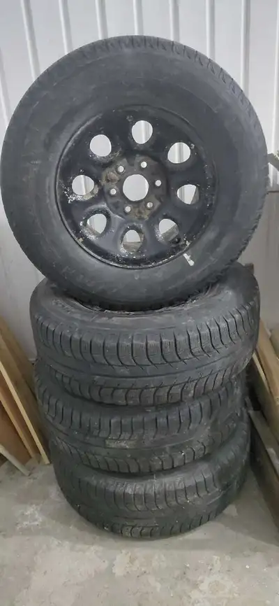 Here for sale is a set of four Michelin Lattitude Winter tires mounted and recently balanced on stee...