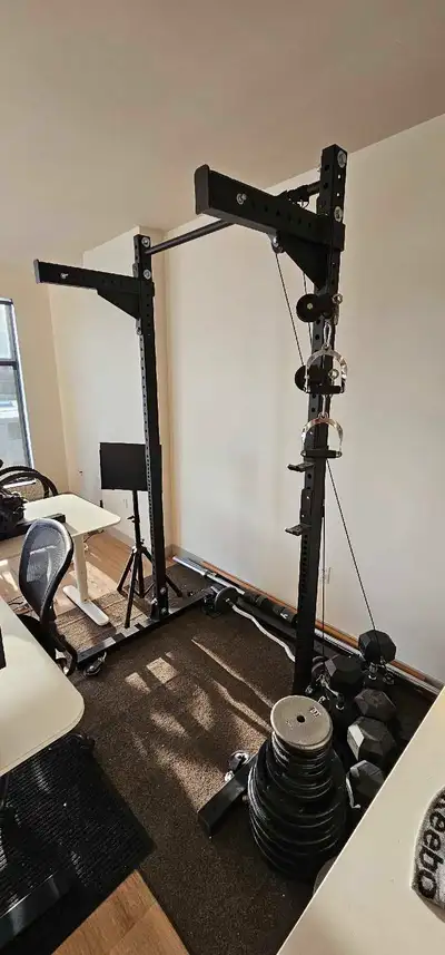 Weight Lifting Frame. Comes with weights & pulley system. Very good condition. Approx 7-8 feet tall....