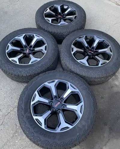 Set of OE alloy 20” GMC wheels and tires off a brand new 2025 GMC Yukon AT4. Wheels are machined and...