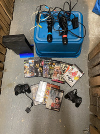PS2 with two controllers, two microphones and 13 games