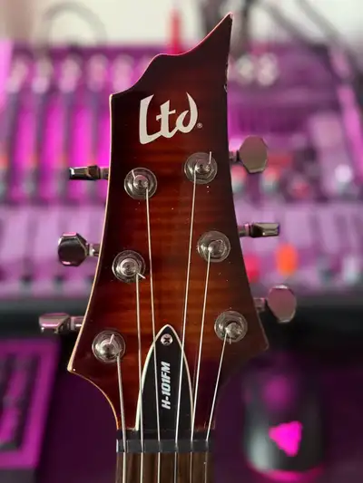 This is a visually striking guitar featuring a gorgeous flame maple top that adds a touch of eleganc...
