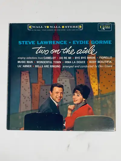 Offering a vintage Steve Lawrence and Eydie Gorme record, titled 'Two on the Aisle,' in very good co...