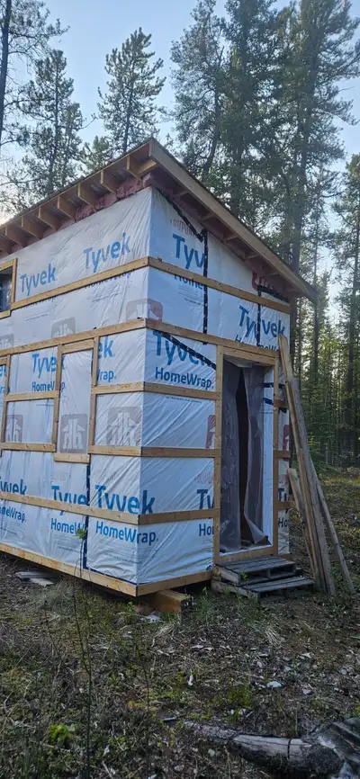 Mostly complete tiny home shell. 8x14 by 12 feet tall. Framed for 4 windows on front Framed for a 36...