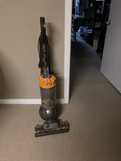 This item is a Dyson Ball Animal upright vacuum cleaner, designed to handle pet hair and deep dirt o...