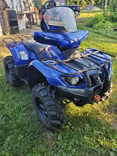 Only 2300km. New battery. In great shape. Comes with tracks and a snow plow.
