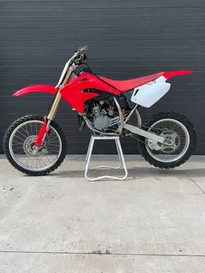 2007 CR85R two-stroke, big wheel bike - runs clean and strong. Tires recently replaced, pro taper ha...