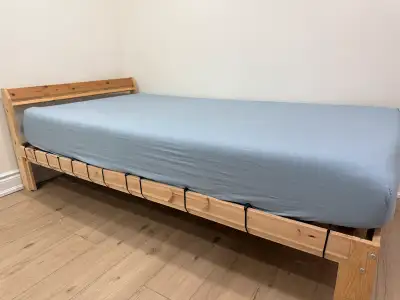 * Wooden twin-size bed frame with a comfortable mattress. * Size in description * Excellent conditio...