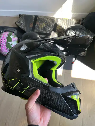 Neon green and black Carbon fiber FXR helmet, nice and lightweight, Helmet is used but is still in g...