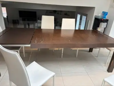 Kitchen table and 6 faux leather chairs. 75 x 39. Has 1 extension of 24 inches so opens to 101 inche...