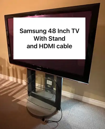 Samsung 48 inch TV with stand and HDMI cable, View more