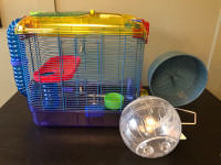 Small pet habitat, exercise wheel and adventure ball