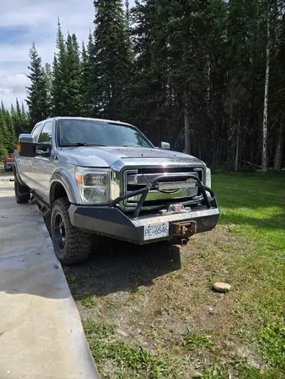 2012 F350 Fx4 Lariat 12k warn winch 30'' and 20'' light bars Fuel rims with 1 year old Cooper m.ts S...
