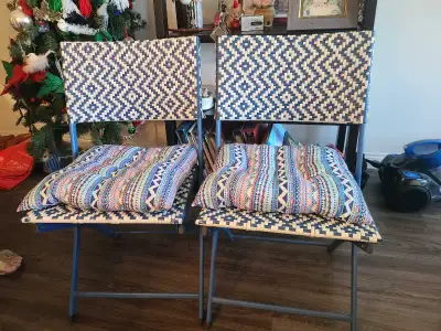 These two pre-owned IKEA folding chairs feature a stylish blue and white woven pattern that brings a...
