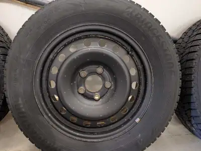 For sale set of 4 Bridgestone blizzak 225/65/17 on rims off a 2017 Chevy Equinox $450 obo Call 204-7...