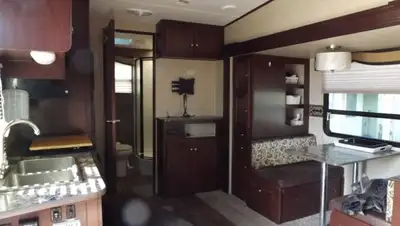 2014 Elkridge by Heartland E22 fifth wheel. Has all standard amenities plus outside food prep area a...