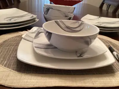 Beautiful dish set by Mikasa. 3 piece place settings for 4. Pattern is Kya Smoke. It has gray swirls...