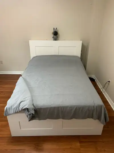 White IKEA BRIMNES full/double bed frame. Includes headboard with built-in shelving. Four large draw...