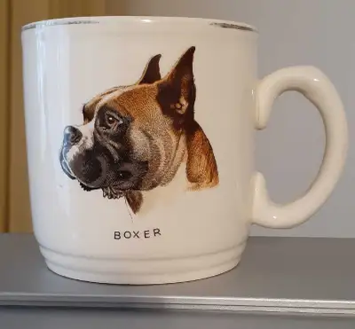 Antique mug with Boxer dog imprint. No chips or cracks, some wear on gold trim on rim. Cash only.