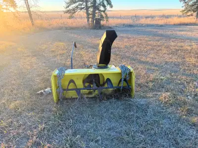 Never been used (doesn’t fit our machine) Comes with tire chains Want gone just sits in the grass 90...