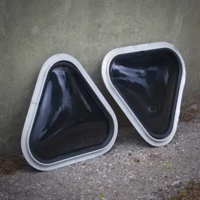 Triangle shaped van windows. Good used condition - previously installed. Installation rings included...