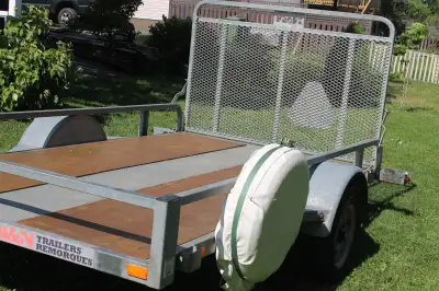Trailer is 66 inches wide by 122 inches long. Trailer is fully galvanized and has a 4 foot long fold...