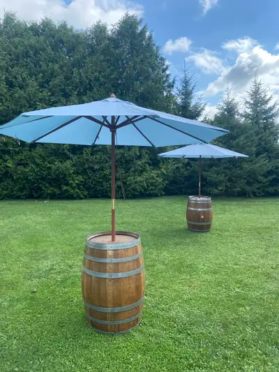 Newly finished wine barrels with installed umbrellas great for pools, events, backyards, conversatio...