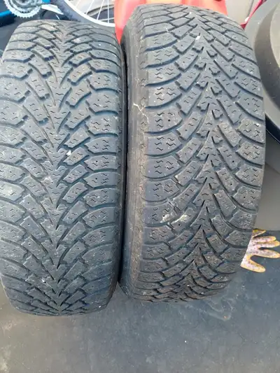 Two Goodyear winter tires 225 65 r16 lots of tread 100 firm