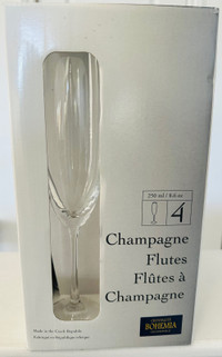 A Set of Four Bohemia Crystalite Champagne Flutes (Brand New)