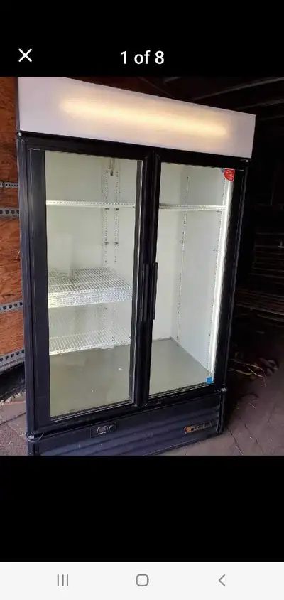 True 2 door cooler in New condition barn doors 54 wide 30 deep 78 high 8 shelves