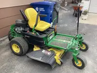 John Deere ZTRAK mower with bagger attachments