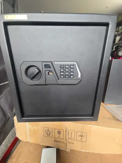 This security safety box features a digital keypad and measures approximately 13x13x14.25 inches, of...