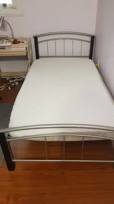 Hardly used, super clean twin size bed with a mattress. Mattress is 5.5 inch thick. Very easy to pic...