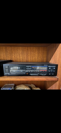 Pioneer Cassette tape deck with assorted cassettes.