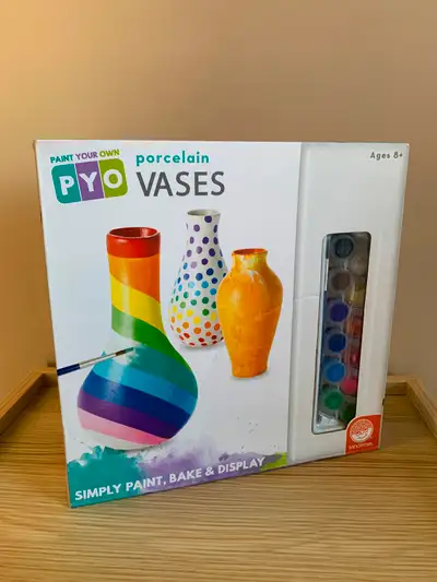 Brand new, sealed in box and never used. Set contains 3 vases (5" tall), 12 bright colors of paint,...