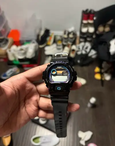 Black G-Shock watch. Digital display. G-Lide series. Features multiple buttons. In brand new conditi...
