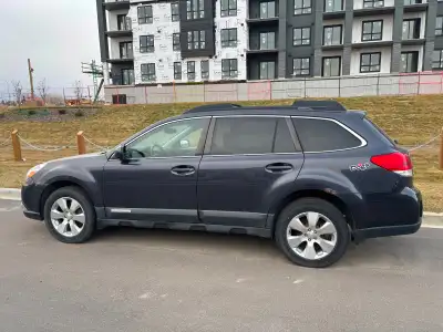 Clean high mileage car. Comes with a set of winter tires on steel rims. Small rust over drivers rear...