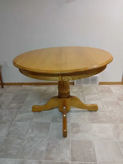 Solid oak round table with 2 leafs 40" x 60", View more
