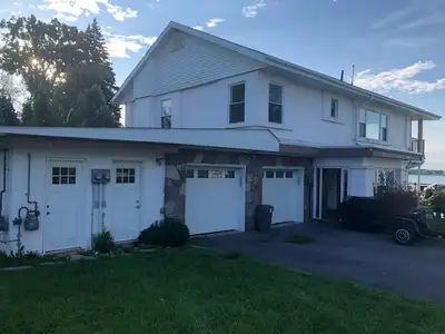 Enjoy breathtaking views of the Bay of Quinte from this beautifully renovated upper-level waterfront...