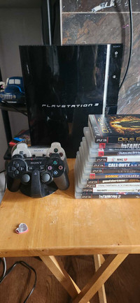 Sony PS3 with 2 controllers and 12 games.