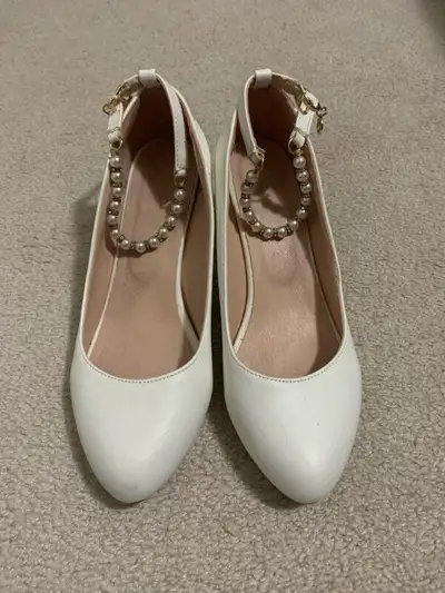 Like new women's white pumps in size 6. $10., View more