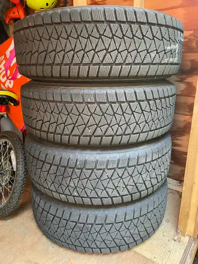 225/65/R17 Like New Blizzak DM-V2 winter tires on black rims. We got a new car and these tires were...
