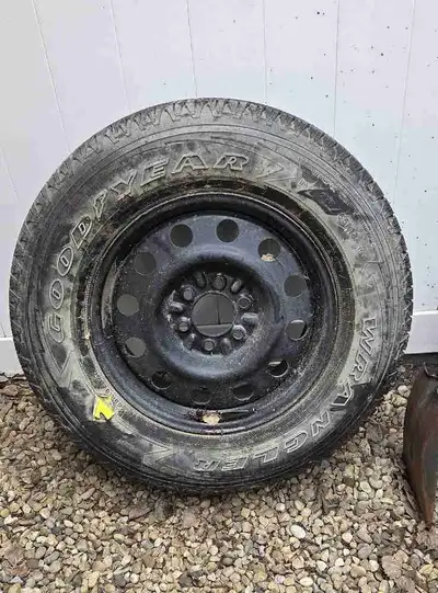 Goodyear Wrangler 275/65 R18 M+S on 6 bolt Rim to fit a Ford F150. Was a Spare tire. Never used. Ask...