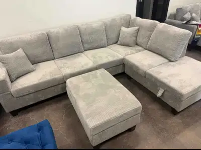 This cozy and stylish light grey corduroy sectional sofa features a spacious layout and comes with a...