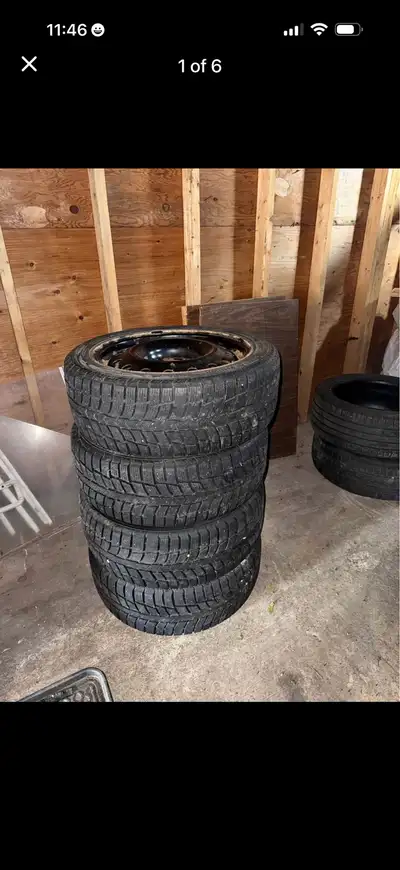 These are four pre-owned Blackhawk winter tires sized 225/45R17 mounted on steel rims. The tires hav...