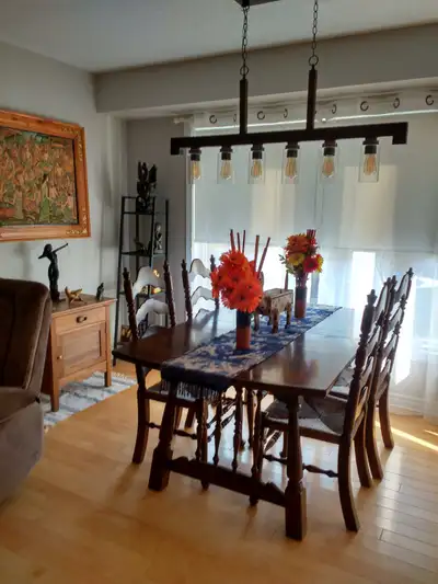 Wooden dining table with extensions, View more