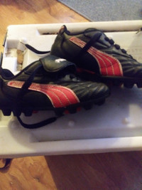 Child's black and red cleats