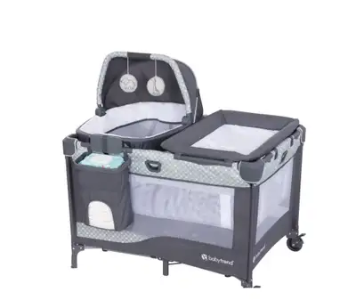 Baby Trend pack & play. Includes removable bassinet with toy ducks, and removable changing table. Ge...