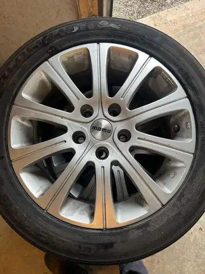 Selling a set of aluminum Momo rims and tires, tires are worn hold air. The rims are in good shape....